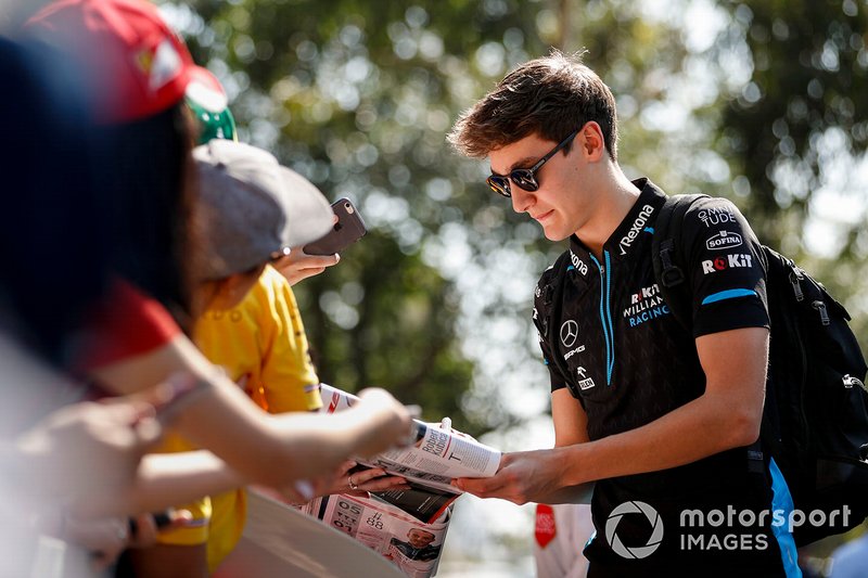 George Russell, Williams Racing signs autographs for fans