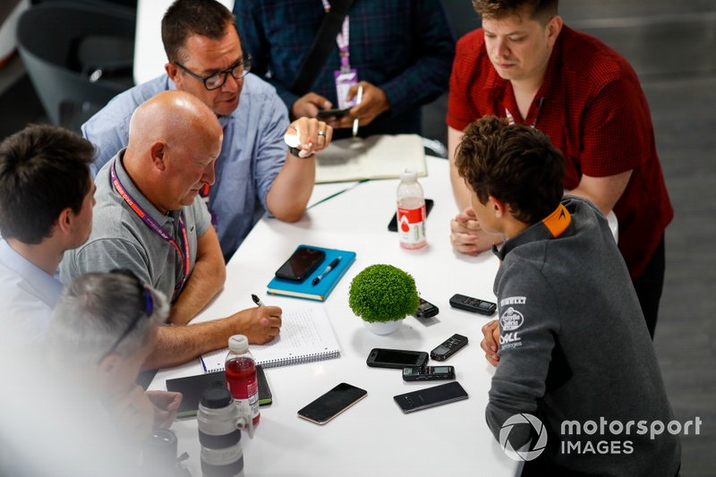 Lando Norris, McLaren, talks to the media