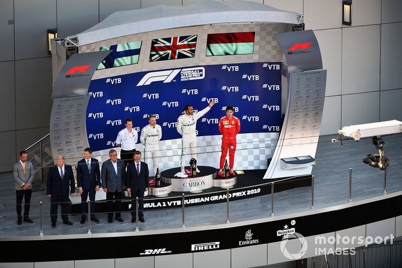 Fred Judd, Chief Engineer Trackside, Mercedes AMG F1, Valtteri Bottas, Mercedes AMG F1, 2nd position, Lewis Hamilton, Mercedes AMG F1, 1st position, and Charles Leclerc, Ferrari, 3rd position, on the podium