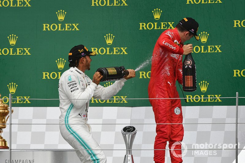Lewis Hamilton, Mercedes AMG F1, 1st position, sprays Charles Leclerc, Ferrari, 3rd position, with Champagne