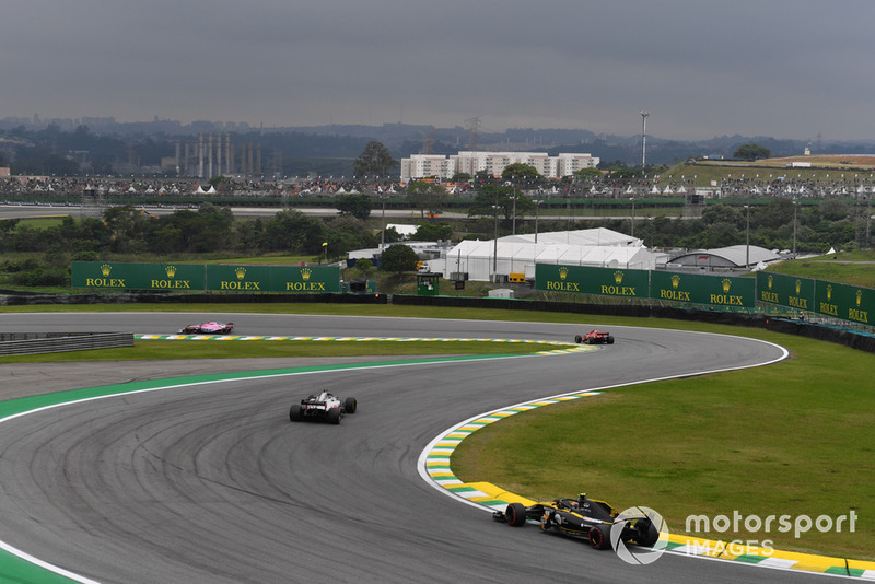 Carlos Sainz Jr., Renault Sport F1 Team R.S. 18 et Romain Grosjean, Haas F1 Team VF-18