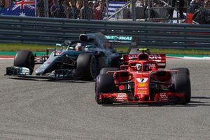 Kimi Raikkonen, Ferrari SF71H, leads Lewis Hamilton, Mercedes AMG F1 W09 EQ Power+