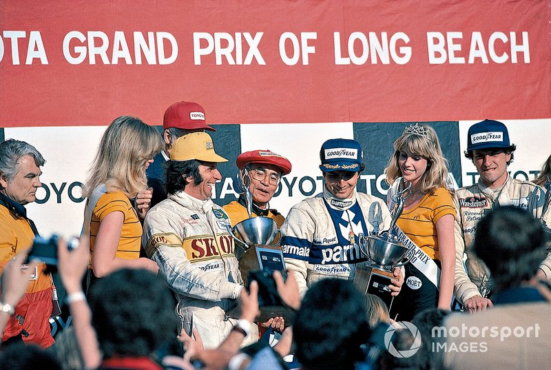 Podium: race winner Nelson Piquet, Brabham, second place Riccardo Patrese, Arrows, third place Emerson Fittipaldi