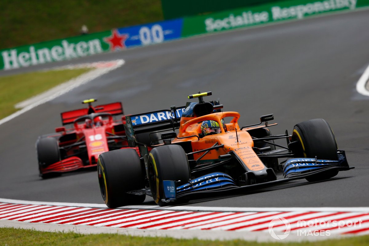 Lando Norris, McLaren MCL35, leads Charles Leclerc, Ferrari SF1000