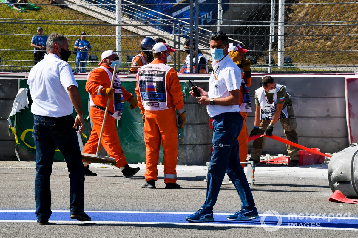 Michael Masi, Race Director with marshals recovering the car of Jack Aitken, Campos Racing after crashing with Luca Ghiotto, Hitech Grand Prix