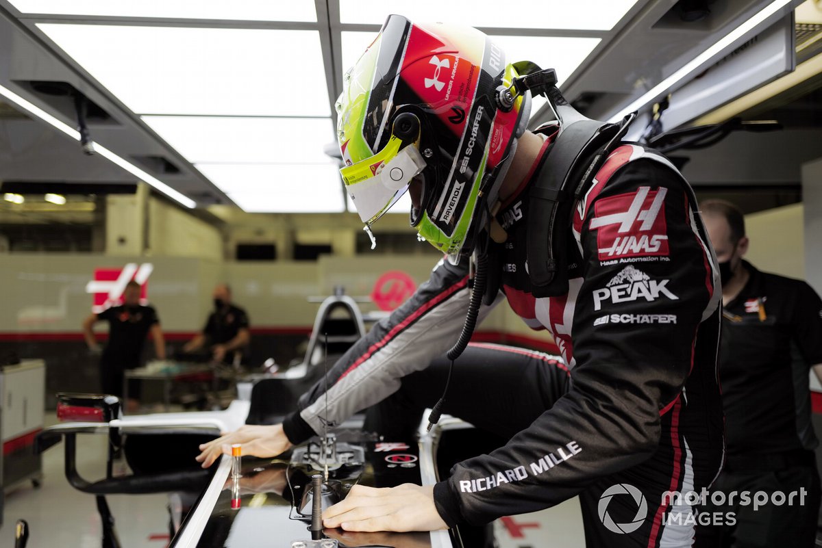 Mick Schumacher sits in his Haas VF-20 for his seat fitting.