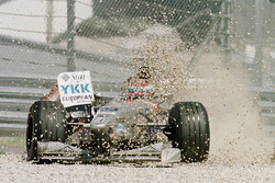 Esteban Tuero, Minardi M198 Ford plough into the gravel on the first corner