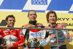 Podium: race winner Valentino Rossi, Repsol Honda Team, second place Loris Capirossi, Ducati Team, third place Nicky Hayden, Repsol Honda Team