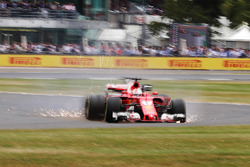 Sebastian Vettel, Ferrari SF70H, runs off the road with a front puncture