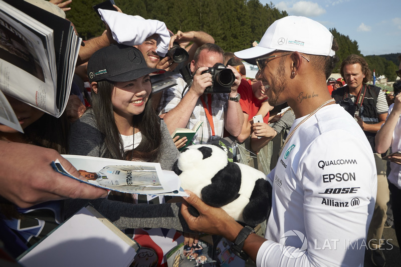 Lewis Hamilton, Mercedes AMG F1, signs autographs for fans