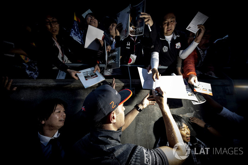 Stoffel Vandoorne, McLaren, signs autographs for fans