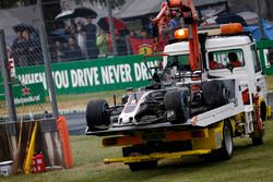 The crashed car of Romain Grosjean, Haas F1 Team VF-17 is recovered in Q1