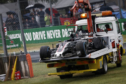 The crashed car of Romain Grosjean, Haas F1 Team VF-17 is recovered in Q1