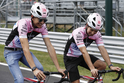Esteban Ocon, Force India, Sergio Perez, Force India, take to the circuit on bicycles