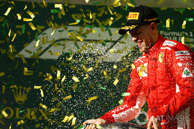 Sebastian Vettel, Ferrari, celebrates victory on the podium