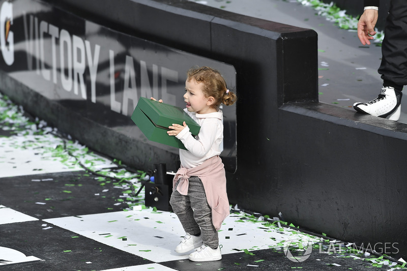 #5 Action Express Racing Cadillac DPi, P:  Filipe Albuquerque's daughter Carolina carries his Rolex off of the podium