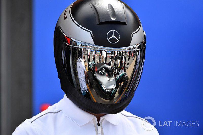 Mercedes AMG F1 mechanic with reflection in helmet
