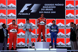Podium: Race winner Michael Schumacher, Ferrari, second place David Coulthard, McLaren, third place Giancarlo Fisichella, Benetton, with footballer Pele and Ferrari Technical Director Ross Brawn