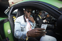 Usain Bolt is taken for a drive by Lewis Hamilton, Mercedes AMG F1