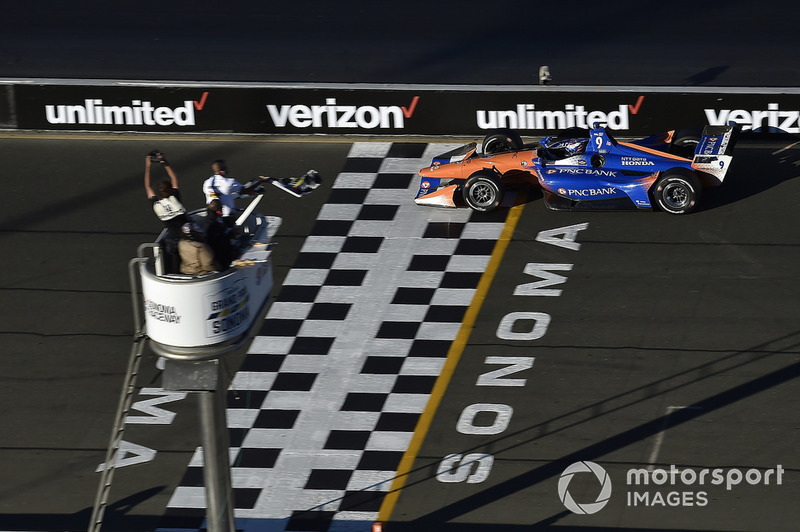 Scott Dixon, Chip Ganassi Racing Honda crosses the finish line under the checkered flag for the championship win