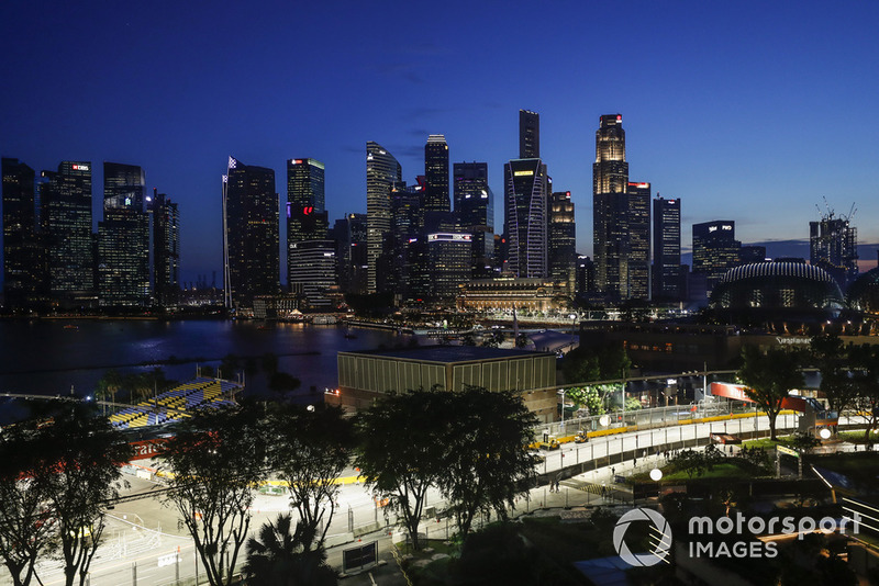 The track is built as darkness falls over the Singapore skyline