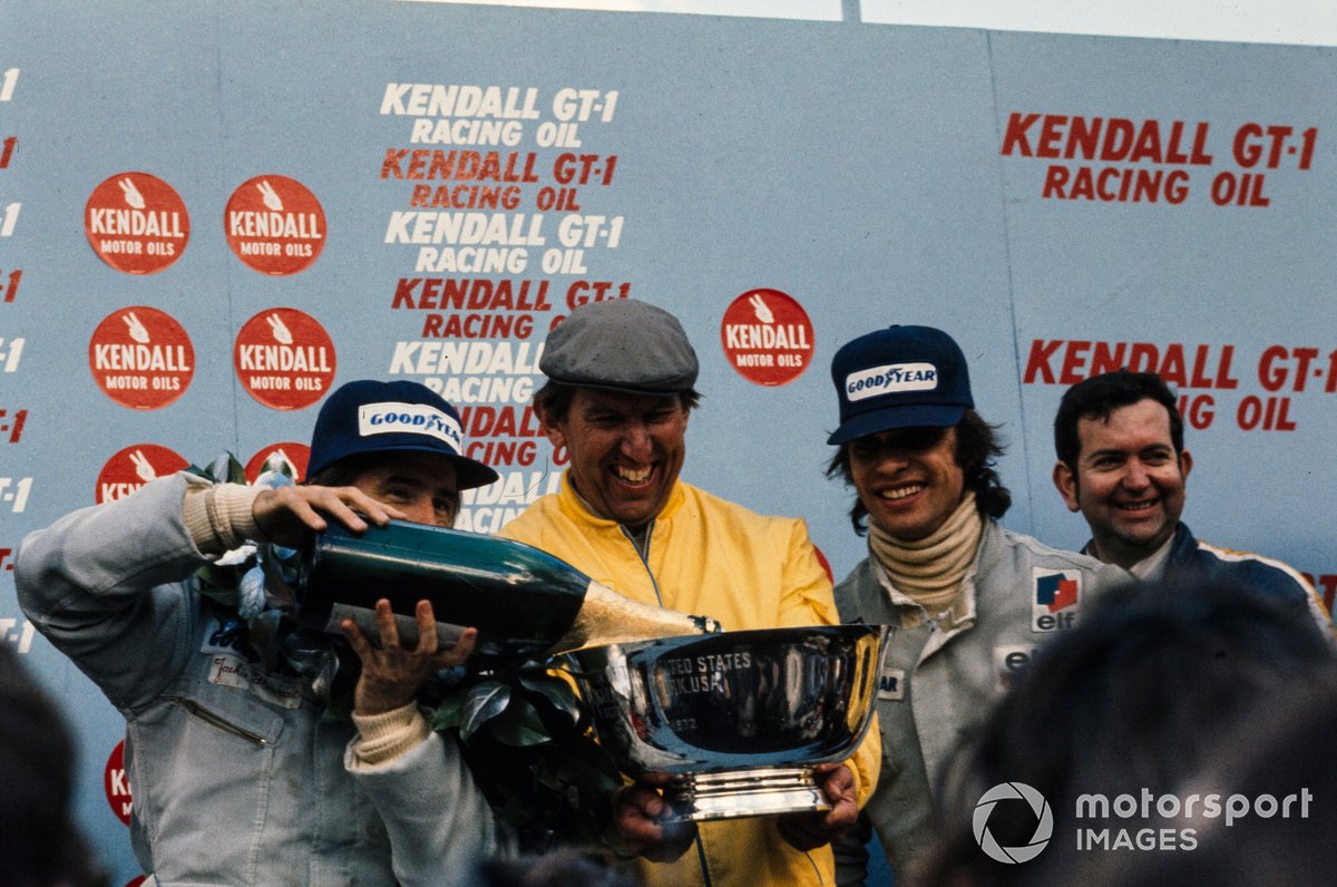 Podium: Ken Tyrrell celebrates with his drivers Race winner Jackie Stewart and François Cevert, Tyrrell