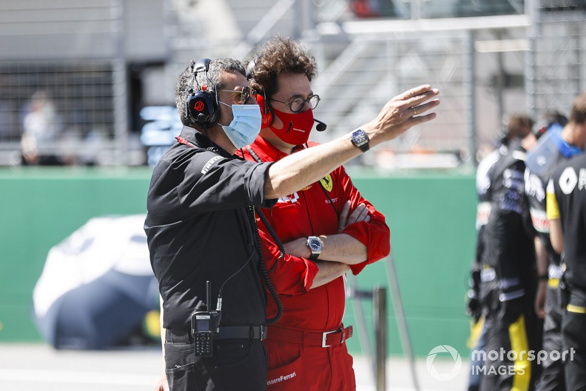 Guenther Steiner, Team Principal, Haas F1, and Mattia Binotto, Team Principal Ferrari, on the grid