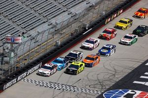 Brad Keselowski, Team Penske, Ford leads the field at the start of the race