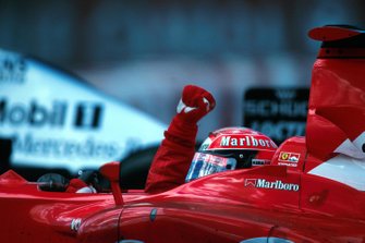 Michael Schumacher, celebrates the 150th GP victory for the Ferrari team