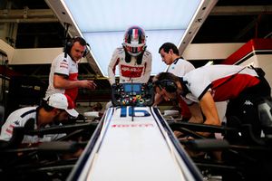 Charles Leclerc, Sauber, enters his cockpit.