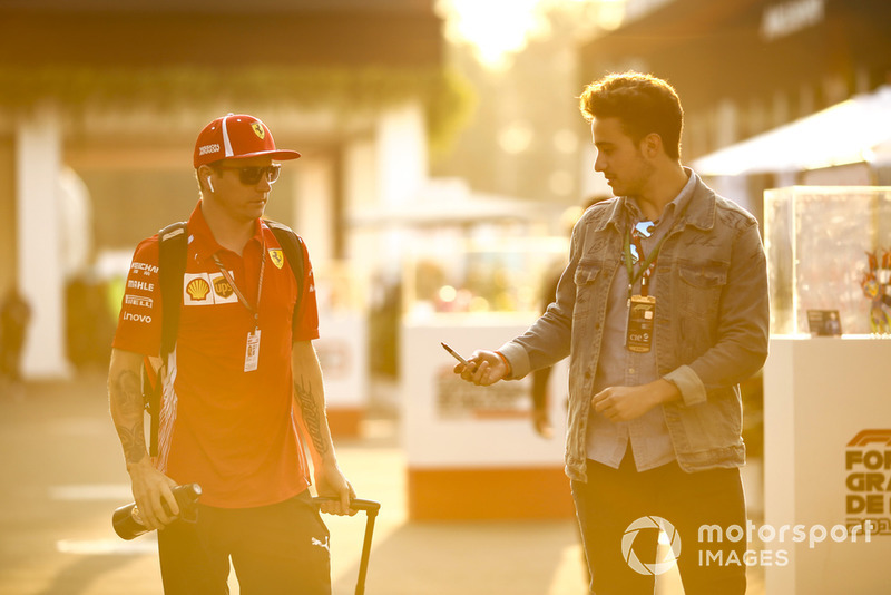 Kimi Raikkonen, Ferrari, signs a an autograph