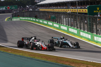 Valtteri Bottas, Mercedes AMG F1 W09 EQ Power+, passes Romain Grosjean, Haas F1 Team VF-18