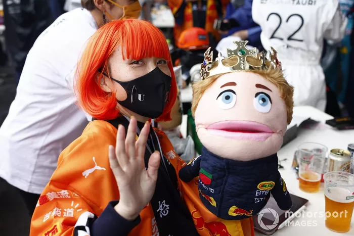 A fan with a Max Verstappen puppet