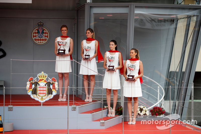 Trophies with grid girls on the podium