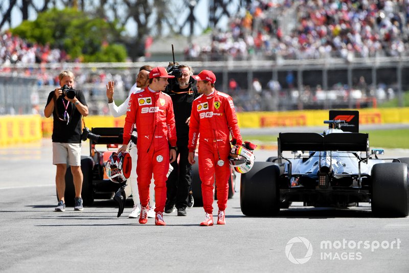 Charles Leclerc, Ferrari, talks with pole man Sebastian Vettel, Ferrari, after Qualifying