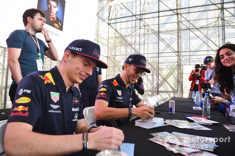 Max Verstappen, Red Bull Racing and Pierre Gasly, Red Bull Racing sign autographs for fans
