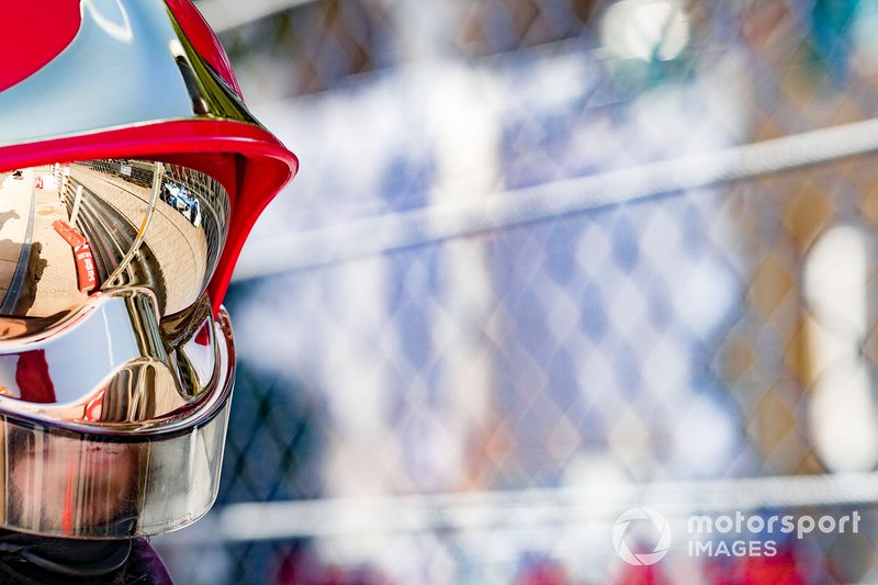 Reflection of a BMW I Andretti Motorsports, BMW iFE.18 in a marshals helmet