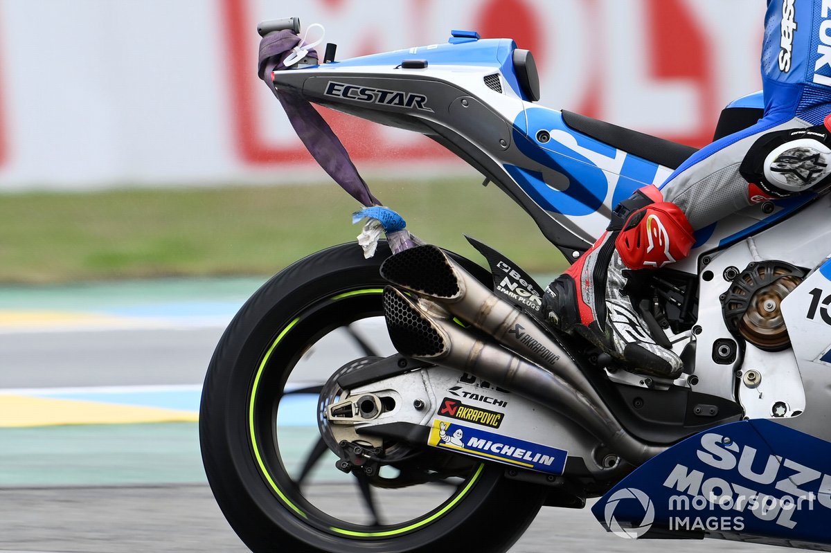 Alex Rins, Team Suzuki MotoGP realising there is a strap attached to his bike