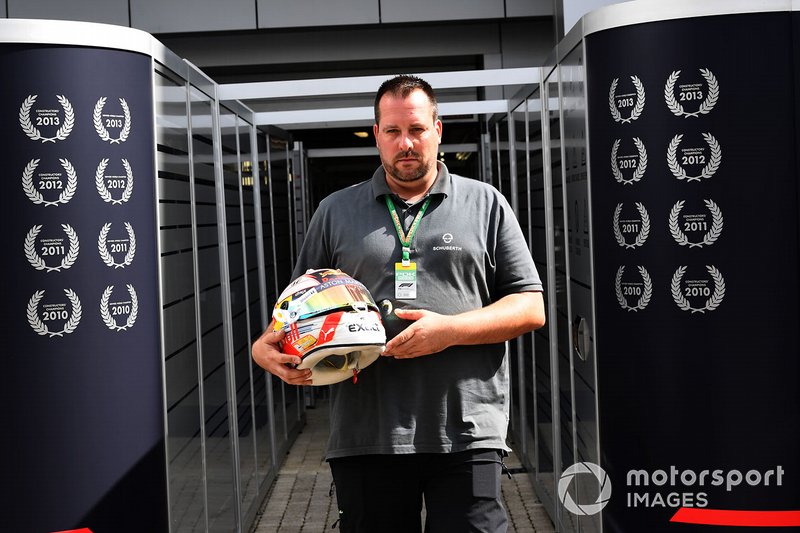 A Schuberth helmet engineer with the helmet of Max Verstappen, Red Bull Racing
