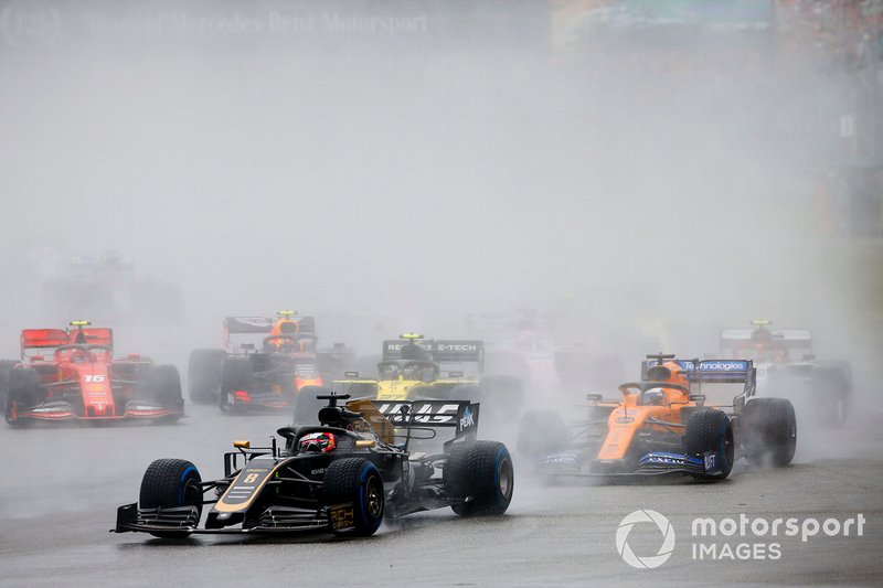 Romain Grosjean, Haas F1 Team VF-19, leads Carlos Sainz Jr., McLaren MCL34, and Nico Hulkenberg, Renault F1 Team R.S. 19
