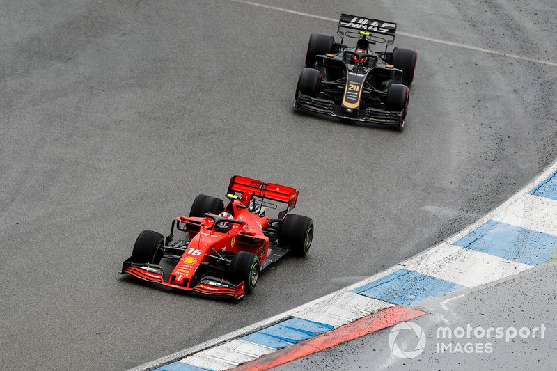 Charles Leclerc, Ferrari SF90, leads Kevin Magnussen, Haas F1 Team VF-19