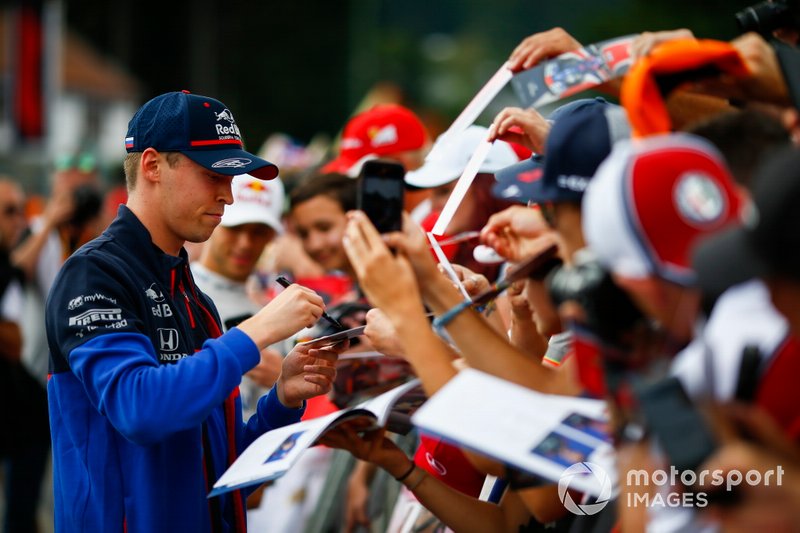 Daniil Kvyat, Toro Rosso, signs autographs for fans