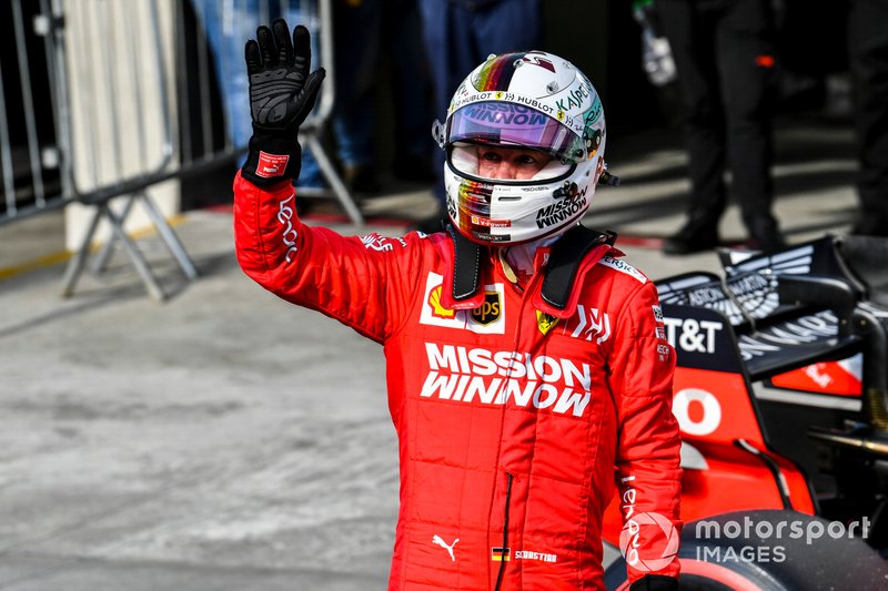 Sebastian Vettel, Ferrari, waves to fans after Qualifying on the front row