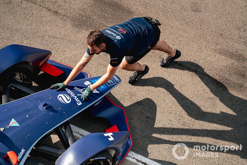 A mechanic pushes Robin Frijns, Envision Virgin Racing, Audi e-tron FE06 back into the garage