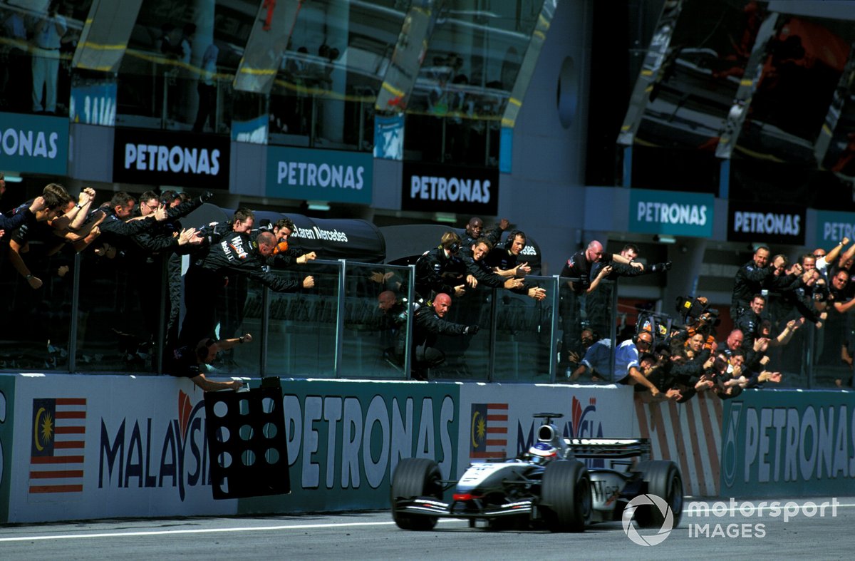 Kimi Raikkonen , McLaren Mercedes MP4/17D, crosses the finishing line to take his debut F1 win