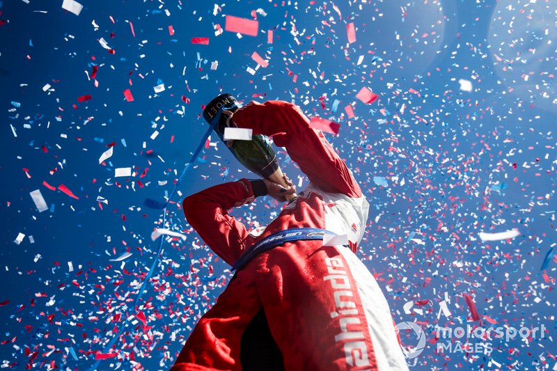 Pascal Wehrlein, Mahindra Racing, celebrates his maiden podium finish on the podium