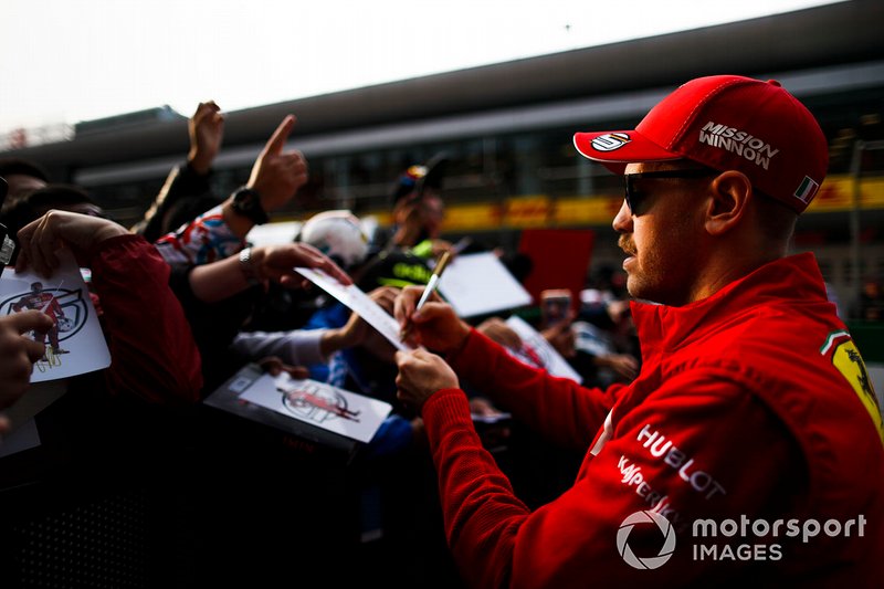 Sebastian Vettel, Ferrari signs an autograph for a fan