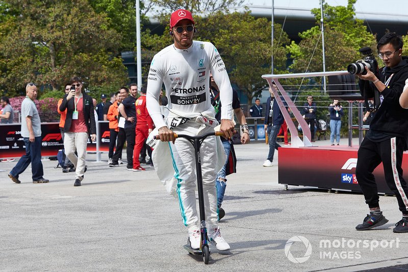 Lewis Hamilton, Mercedes AMG F1, on his scooter