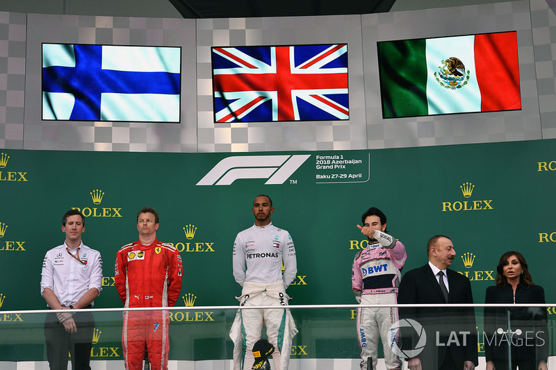 Kimi Raikkonen, Ferrari, Lewis Hamilton, Mercedes-AMG F1 and Sergio Perez, Force India on the podium