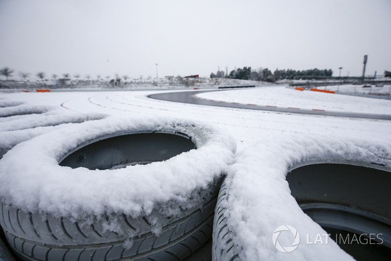Snow covered tires overlooking the circuit